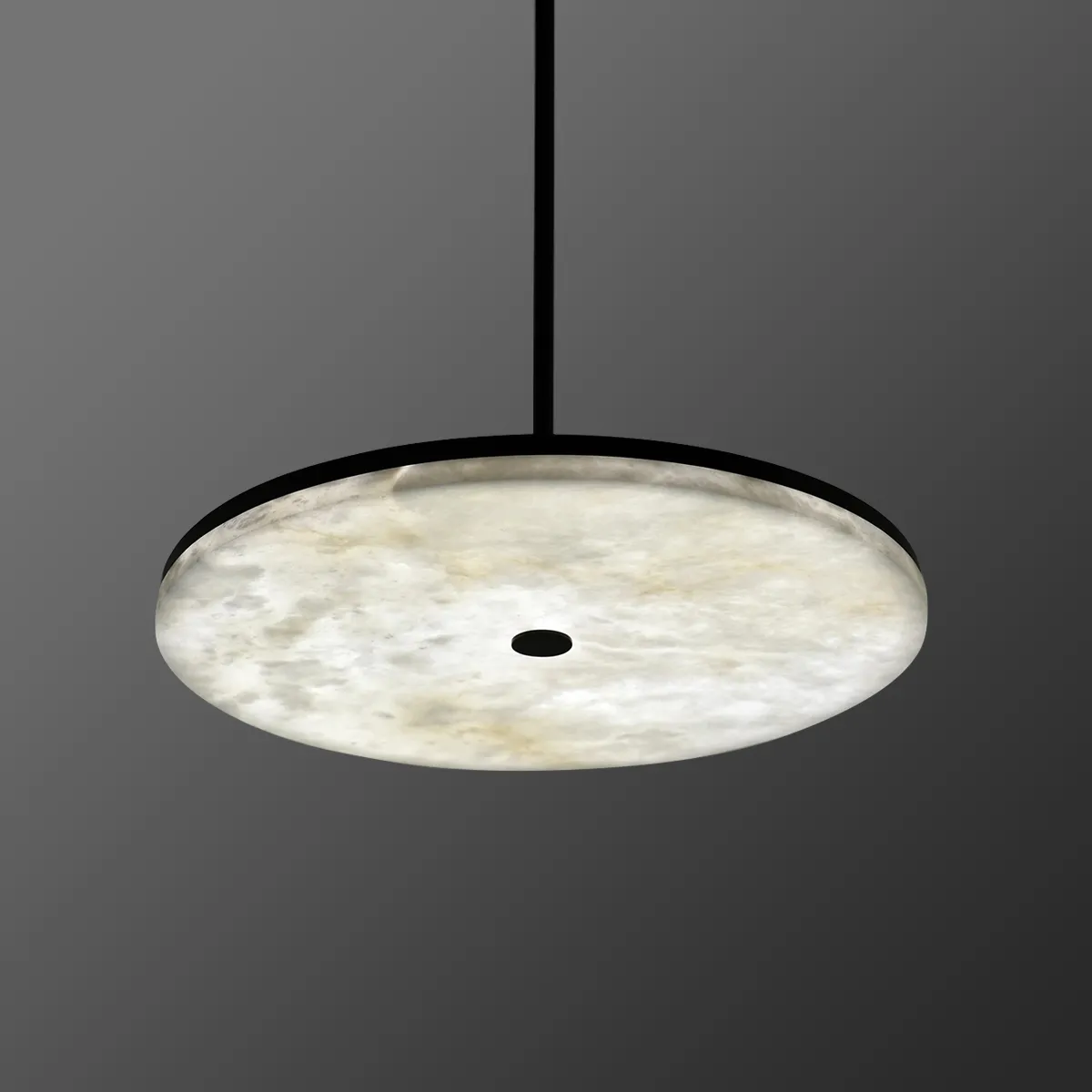 Disc alabaster pendant light showing warm ambient glow